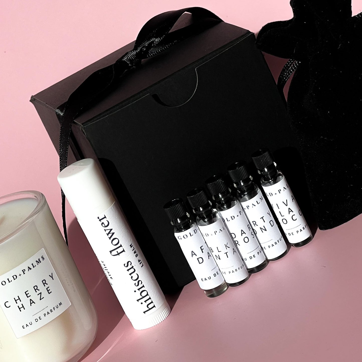 Gold and Palms Best sellers gift set with candle, lip balm, and 5 piece eau de parfum sample set