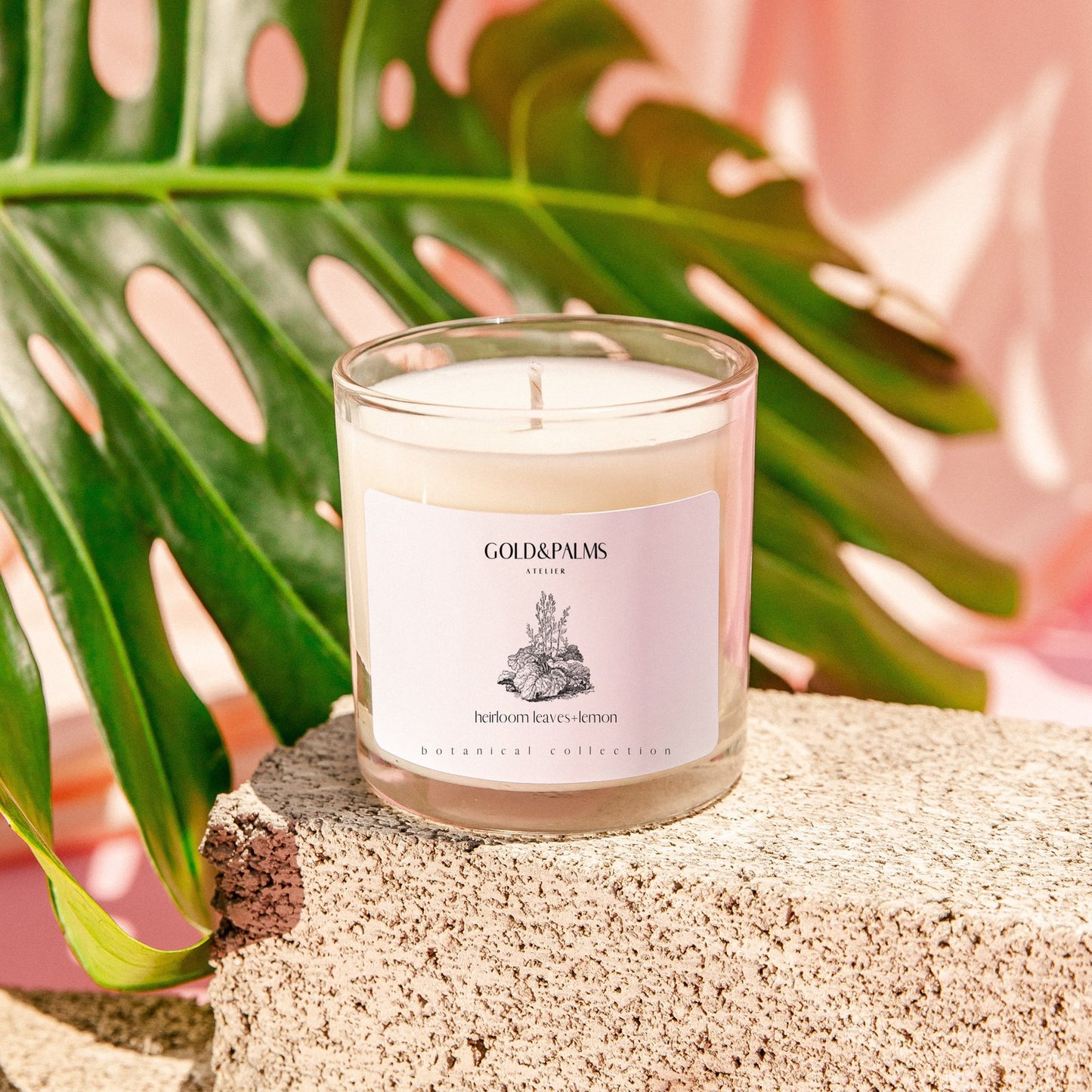 Tomato leaf and lemon soy wax candle in clear 10 oz vessel with tropical background