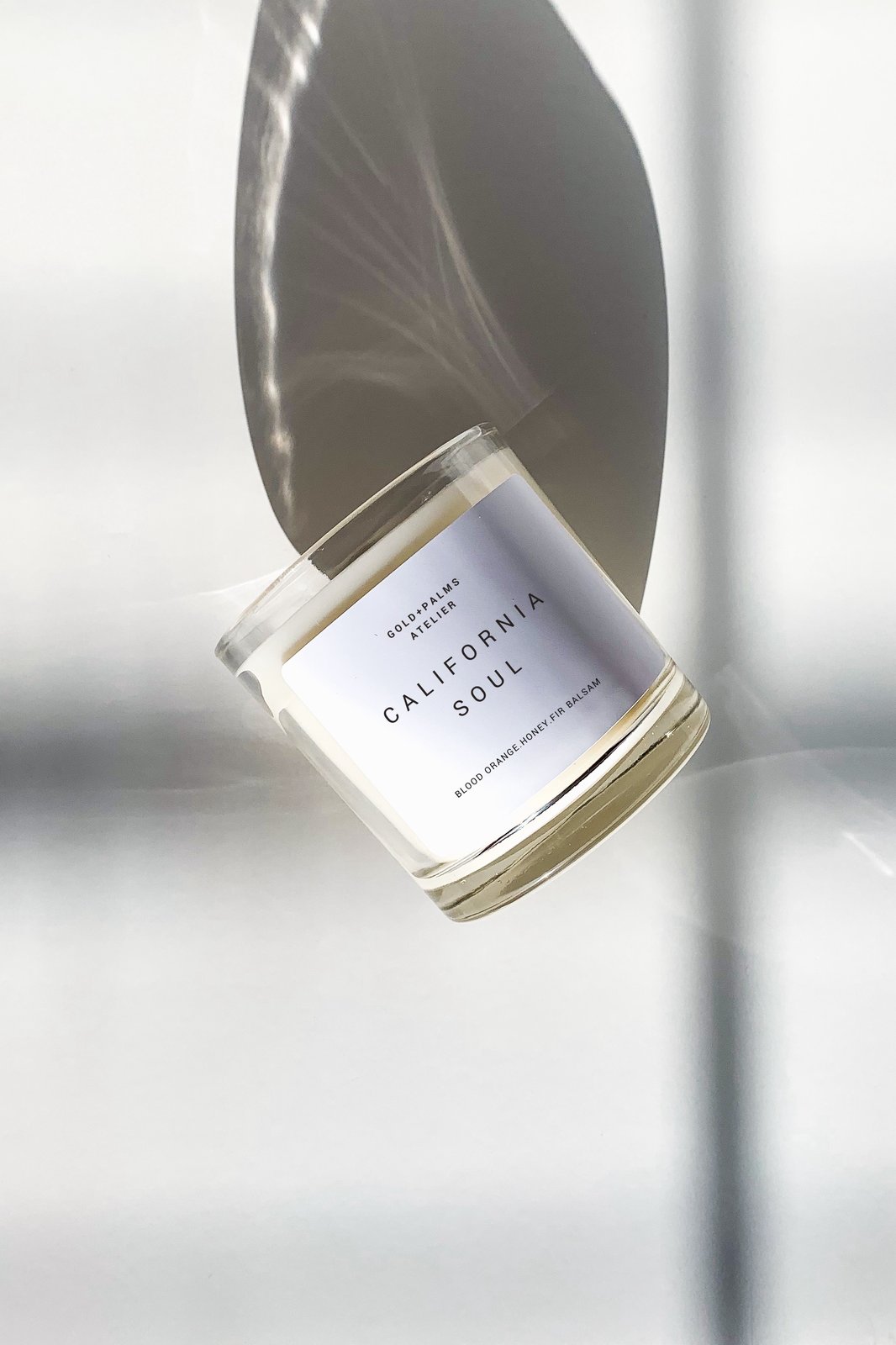 blood orange honey soy wax candle in clear vessel with white background