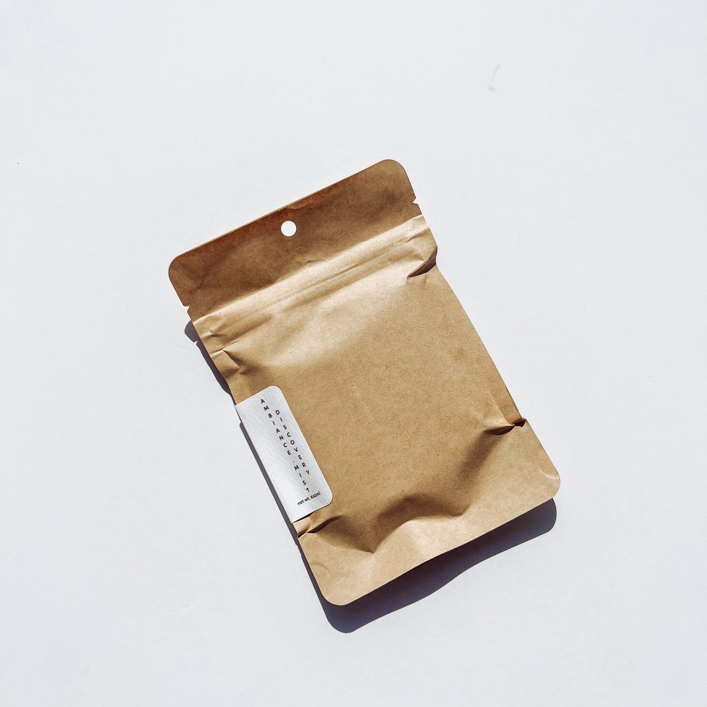 gender neutral discovery set in brown paper packaging