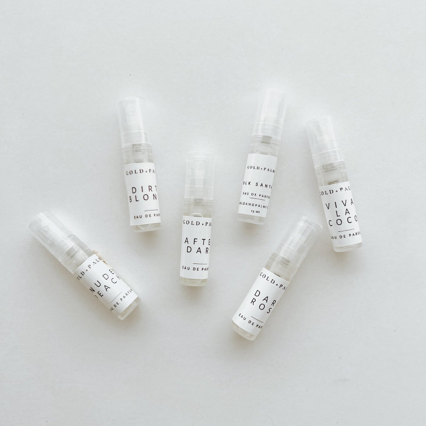 Gold and Palms Original Six 2 ml spray atomizer bottles with white background