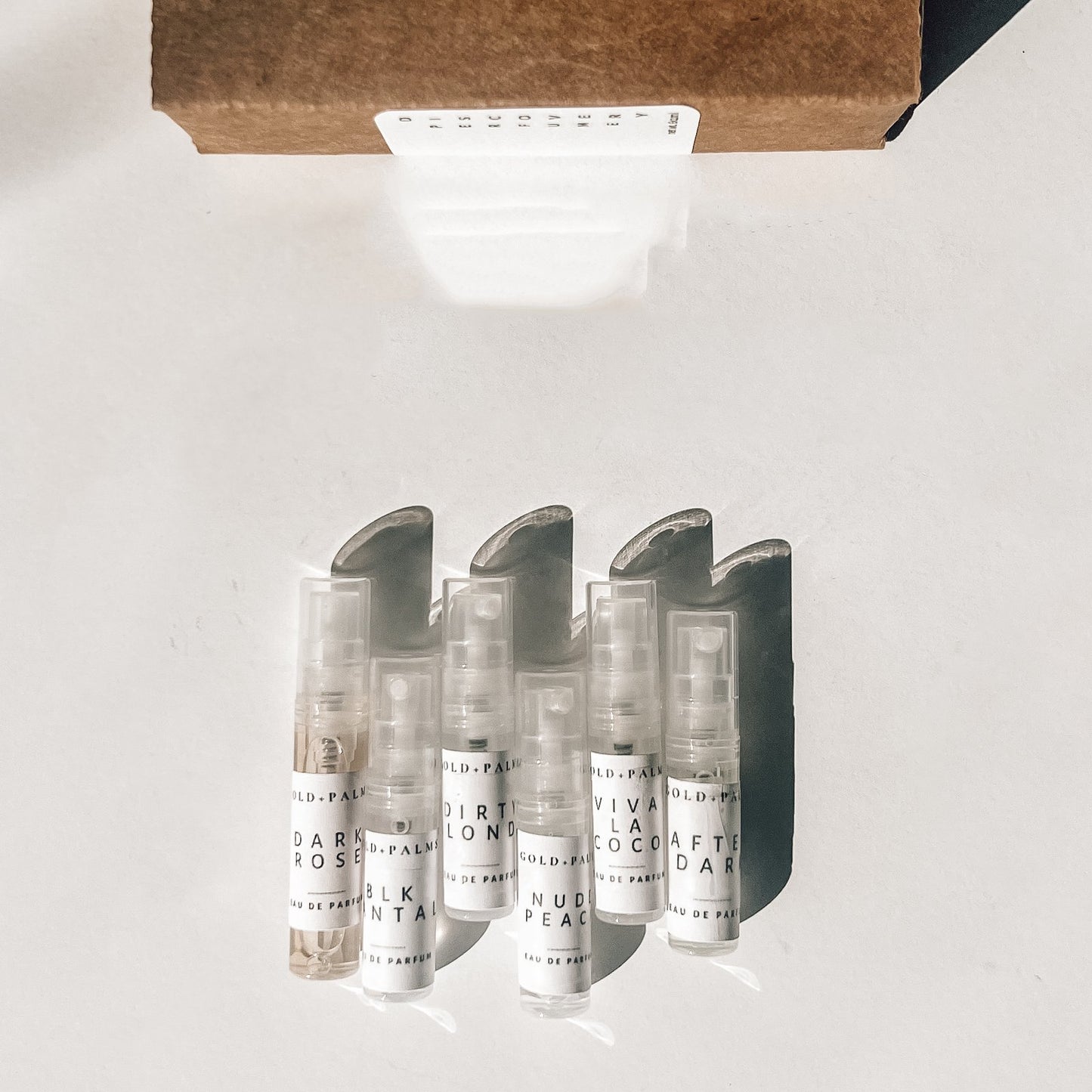 Gold and Palms Original Six 2 ml spray atomizer bottles with white background
