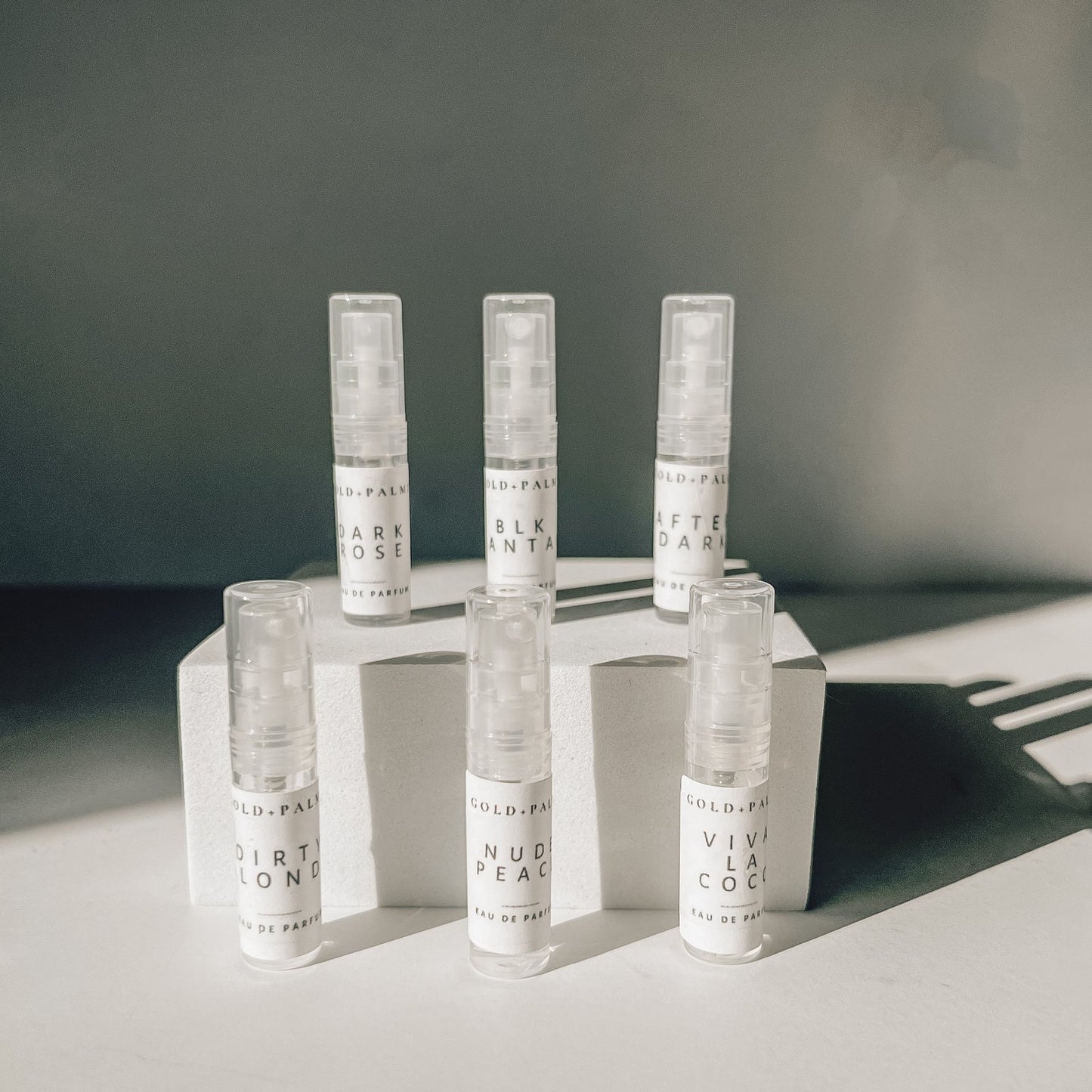 Gold and Palms Original Six 2 ml spray atomizer bottles with white background
