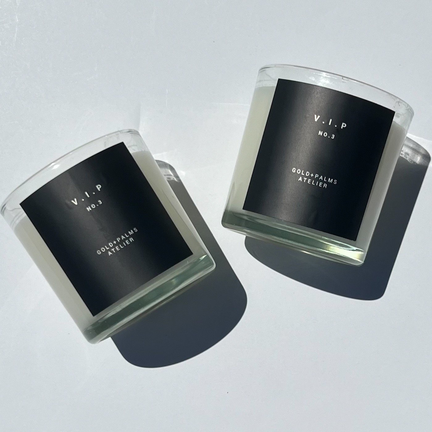 vip candle with black label against white background