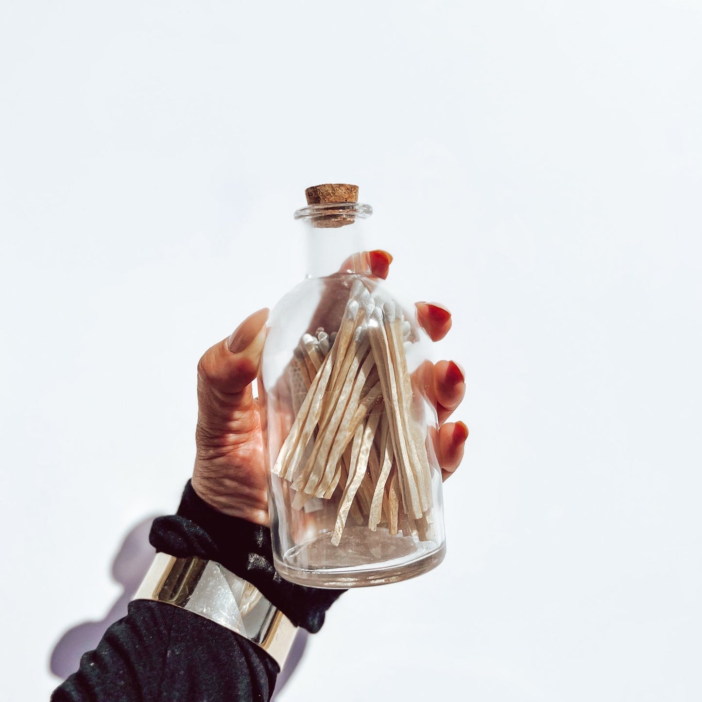 Apothecary’s-Style Candle Matches in glass jar held against a white background