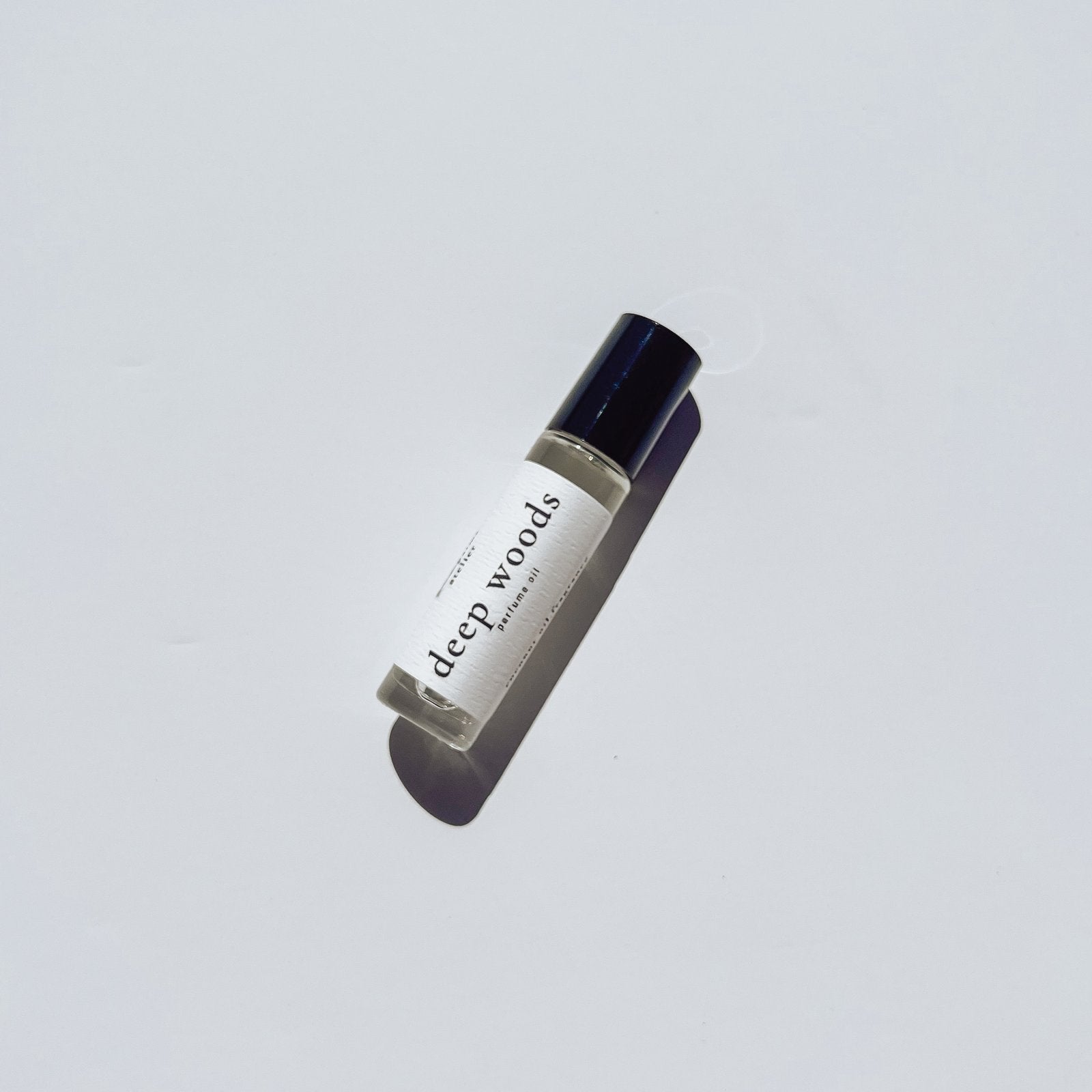 10 ml roller ball perfume oil with white background