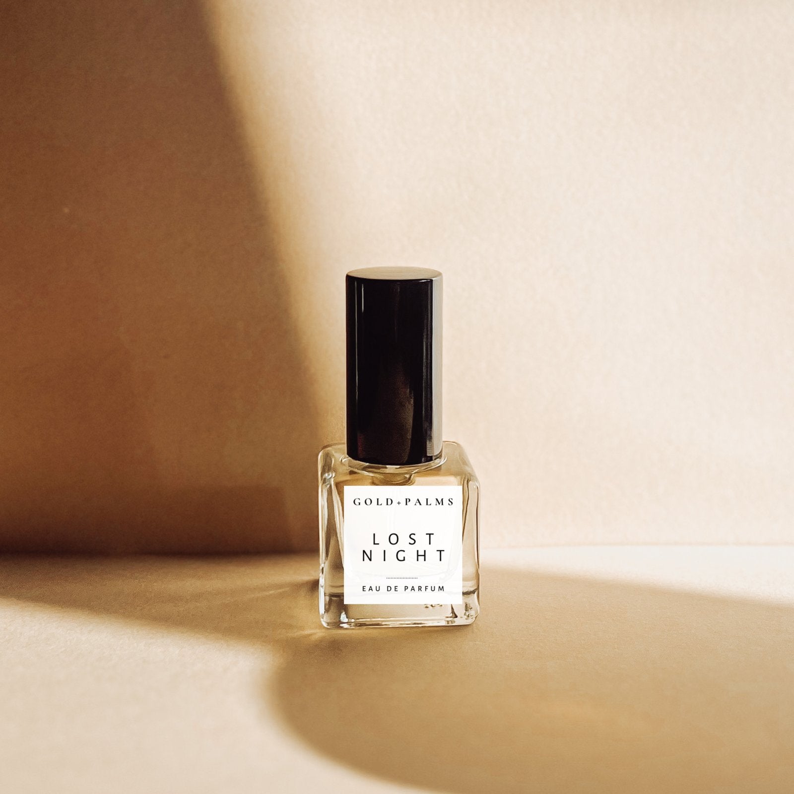 lost night 15 ml atomizer perfume against cream background