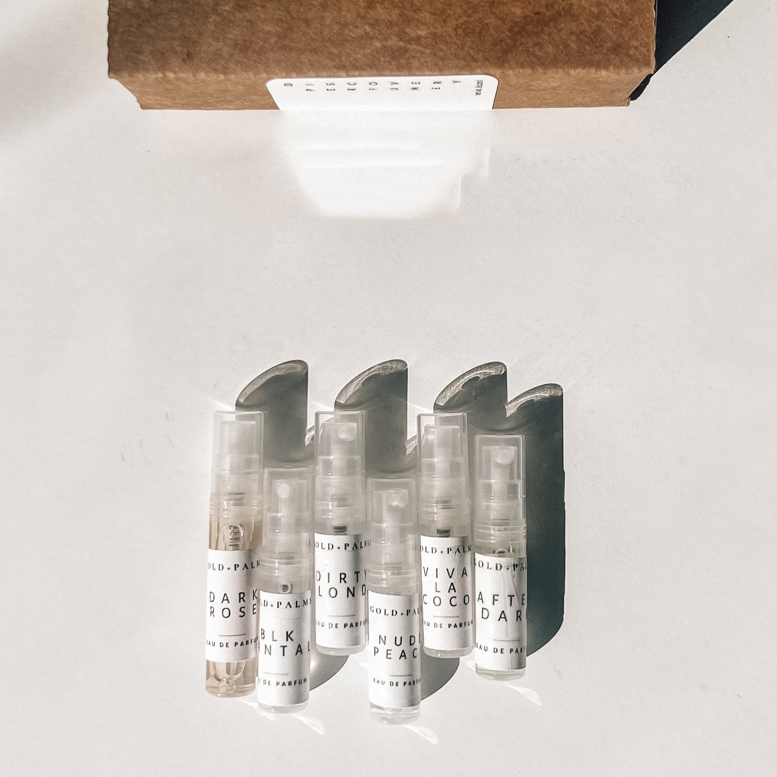 Gold and Palms Original Six 2 ml spray atomizer bottles with white background 