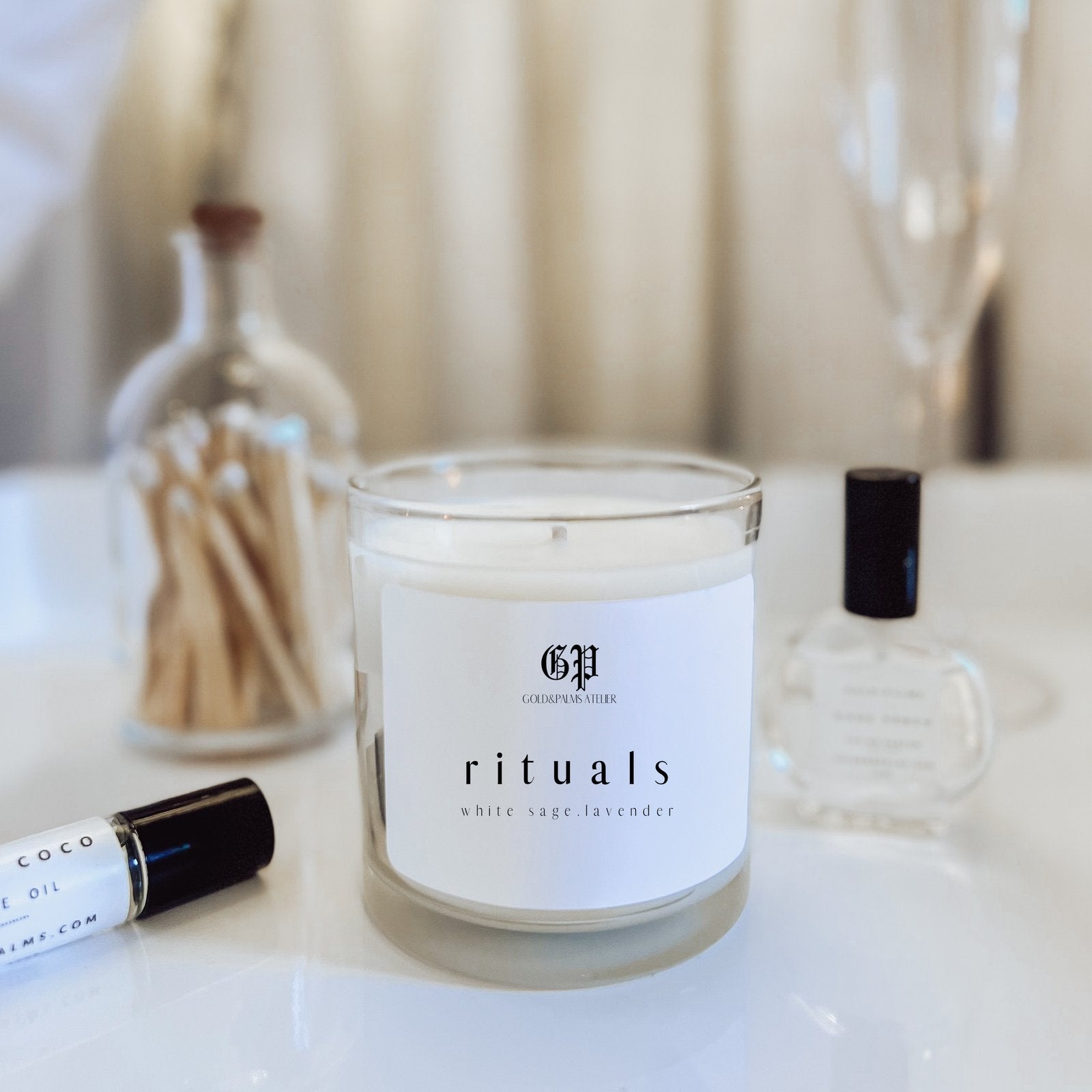 ritual lavender and sage soy candle with clear vessel with aesthetic background